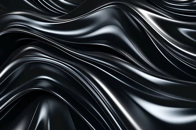 Folds of shining black fabric ripple diagonally across the frame, sharp white highlights running along every crest.