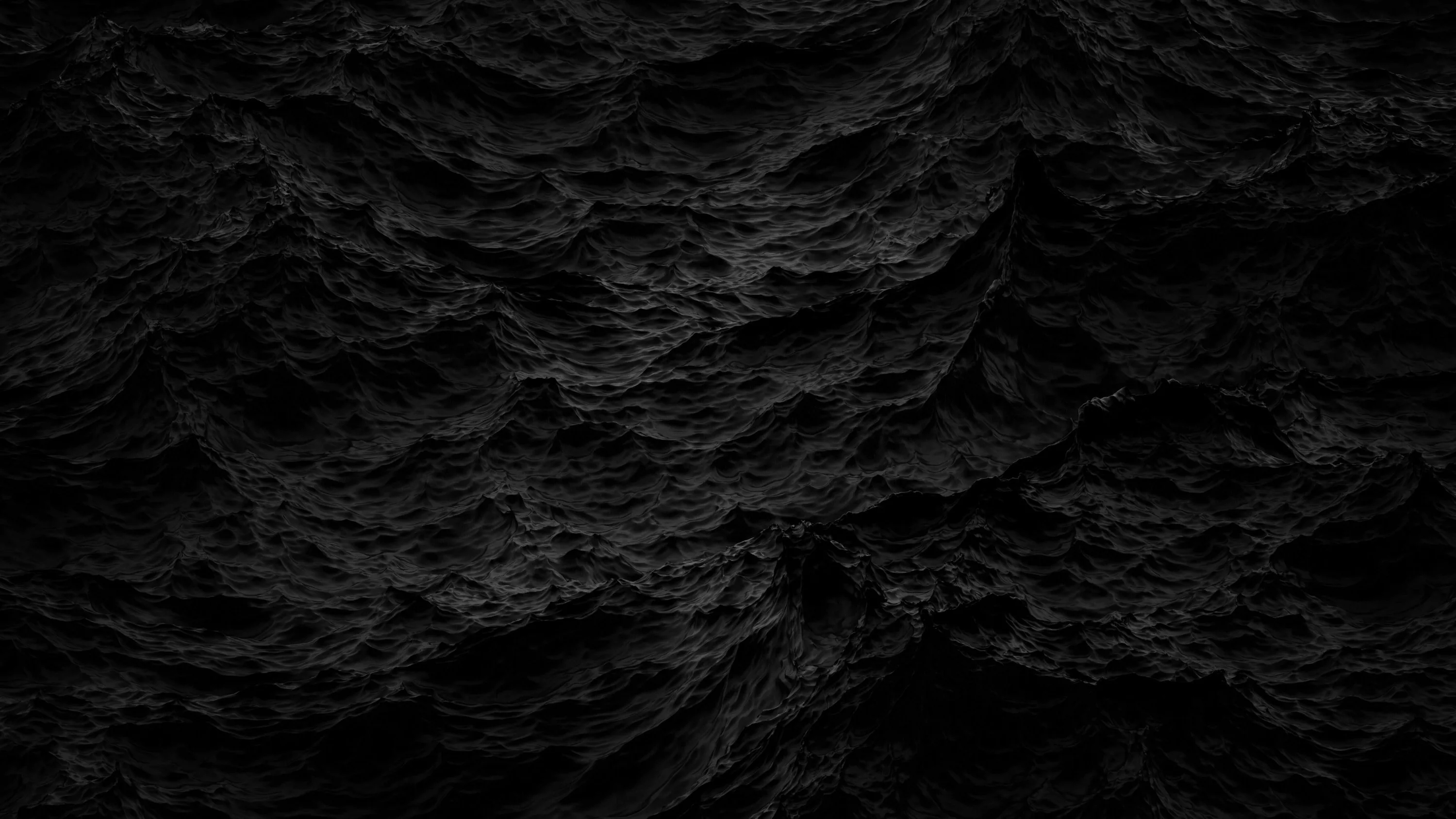 Sharp black rock fills the frame, its ridges catching just enough light to separate from the shadow between them.