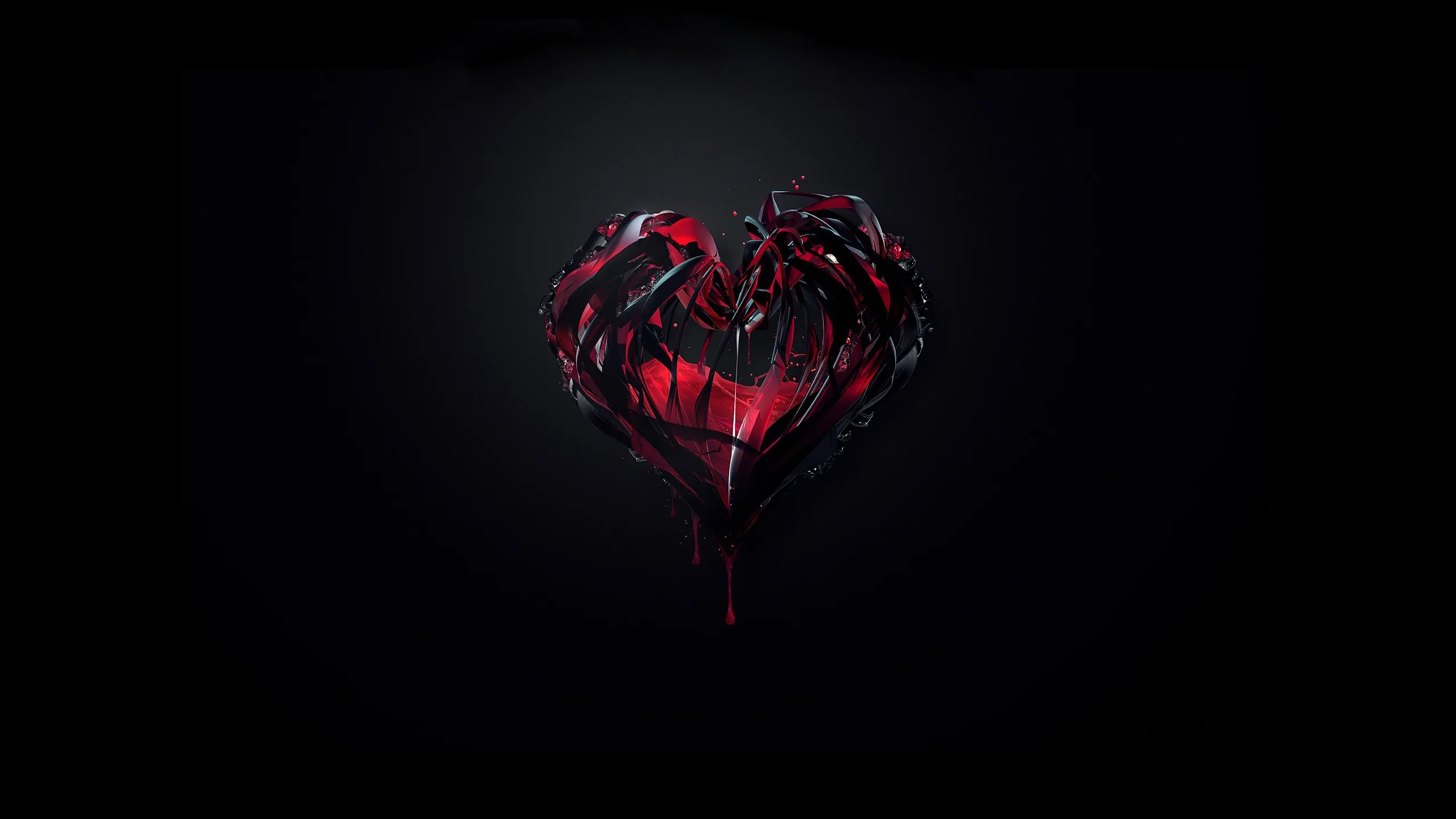 A dark crimson heart of jagged glassy shards floats centred in near-total black, light catching only along its broken facets.