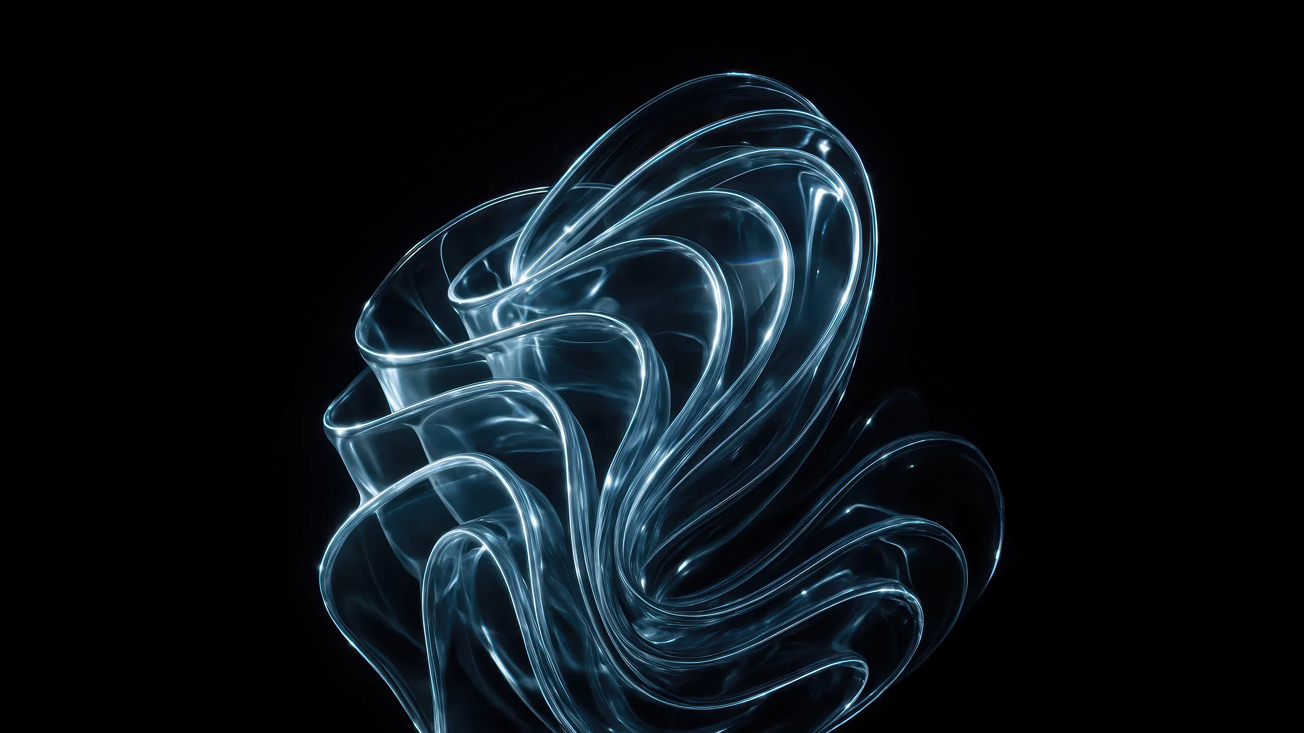 A pale blue ribbon of glass folds over itself in the middle of the frame, its edges catching light while everything around it stays black.
