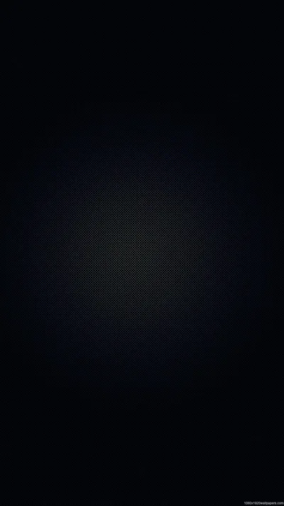 A tall frame of almost-black navy with a faint pool of light behind the middle and a fine fabric weave visible only up close.