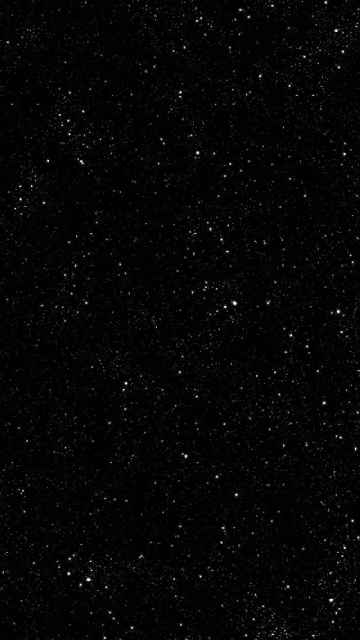 Tiny stars scattered thinly across near-total black — the frame is dark enough to double as an all-black AMOLED background.
