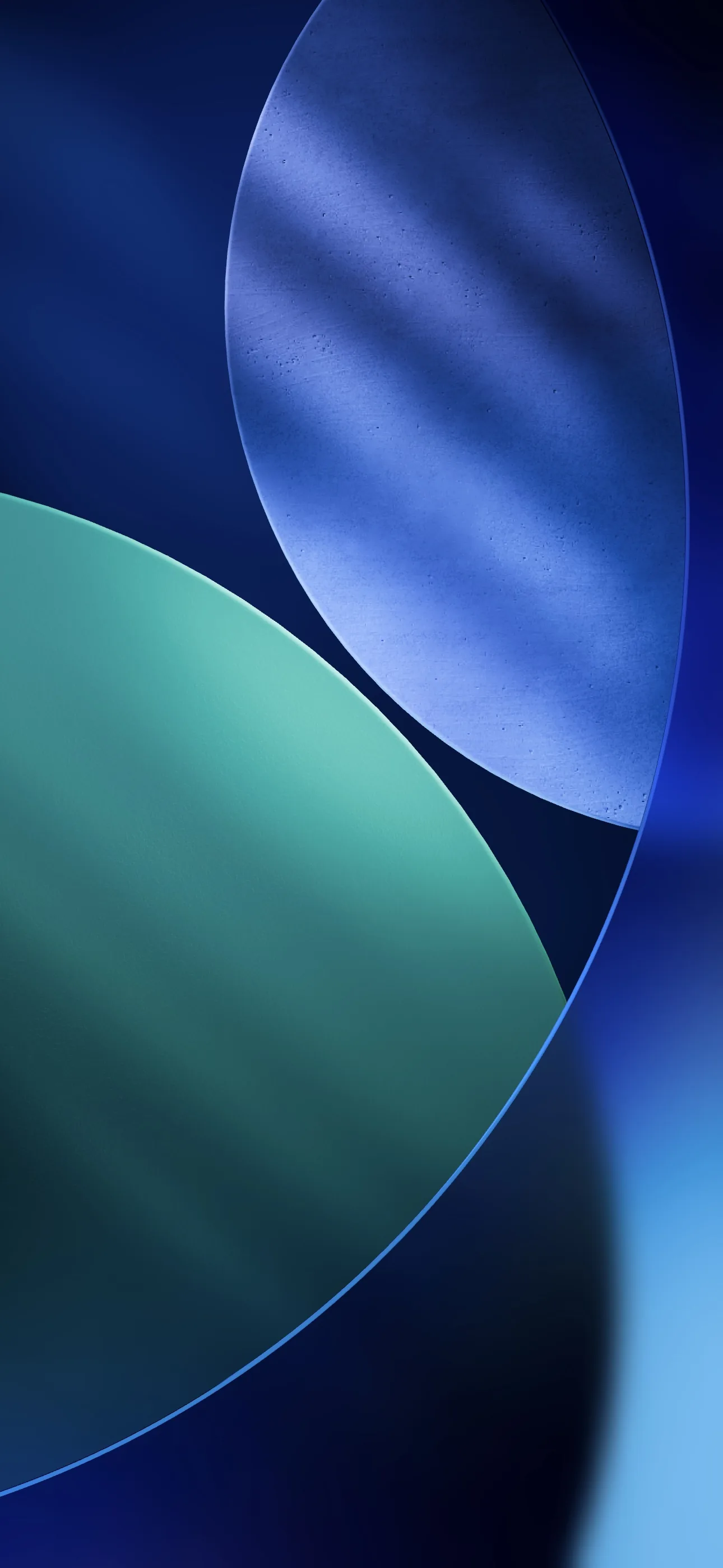 Two frosted circles overlap on deep navy, one brushed steel blue and the other soft green, the seam between them catching the most light.