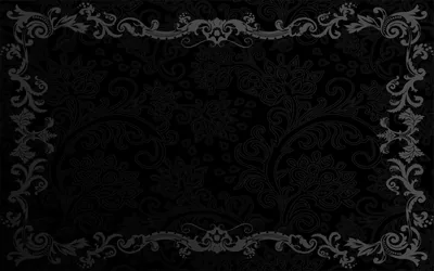 Carved scrollwork forms a border around all four sides, the middle left as a dark panel with a faint pattern behind it.