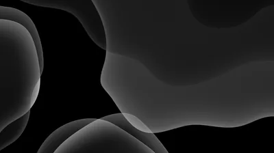 Overlapping soft-edged shapes in grey drift across a black desktop frame, their translucent edges pooling into brighter seams where they cross.