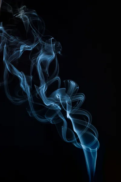 A single thread of pale blue smoke rises from the bottom edge and folds into loops, the right half of the frame kept empty.