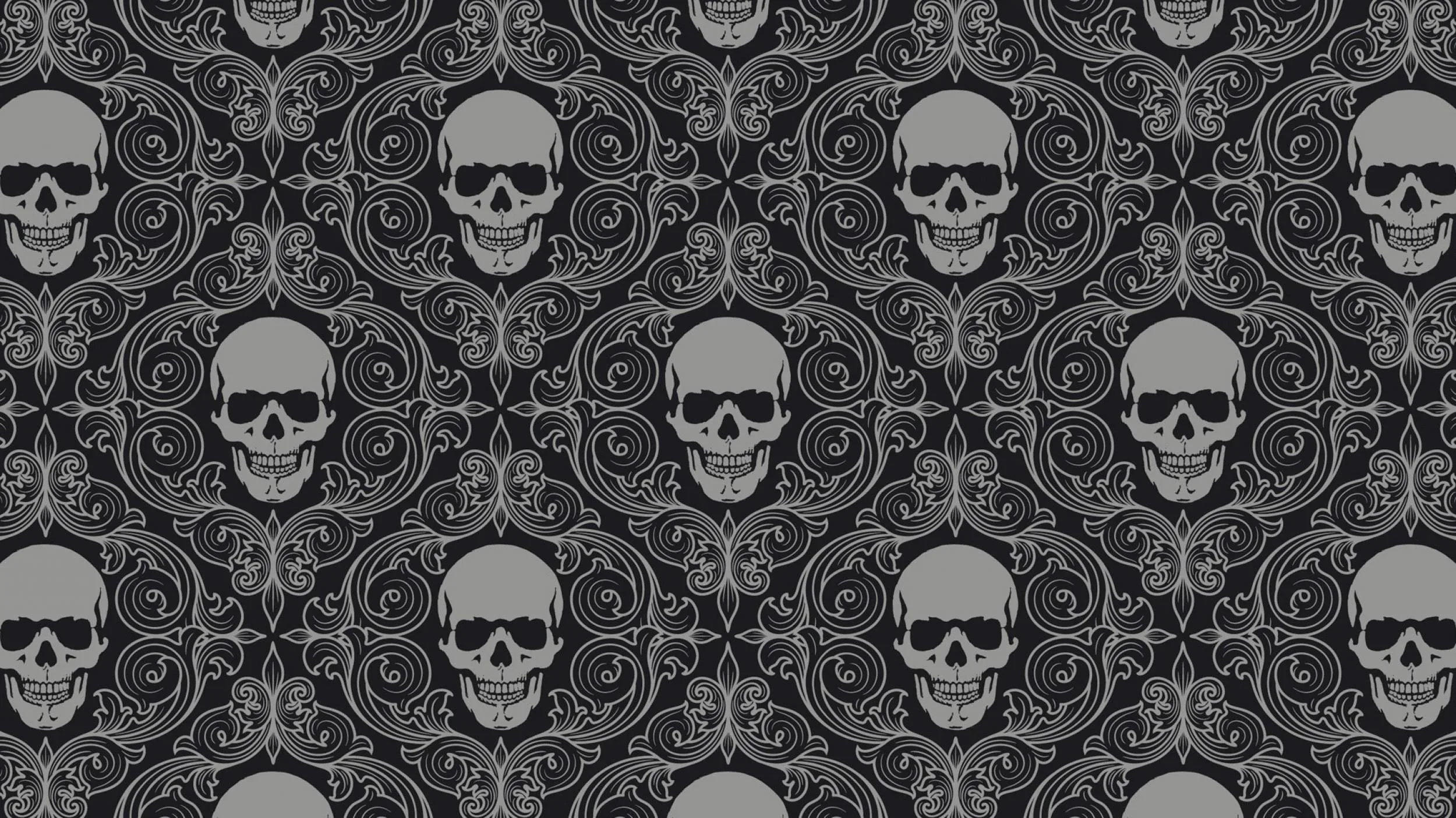 Grey skulls sit in even rows across a dark damask of curling scrollwork, tiling seamlessly in every direction.