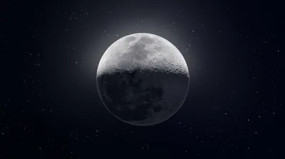 Shadow crosses the moon diagonally, one half in grey light and the other fading into a near-black starfield that suits OLED desktops.