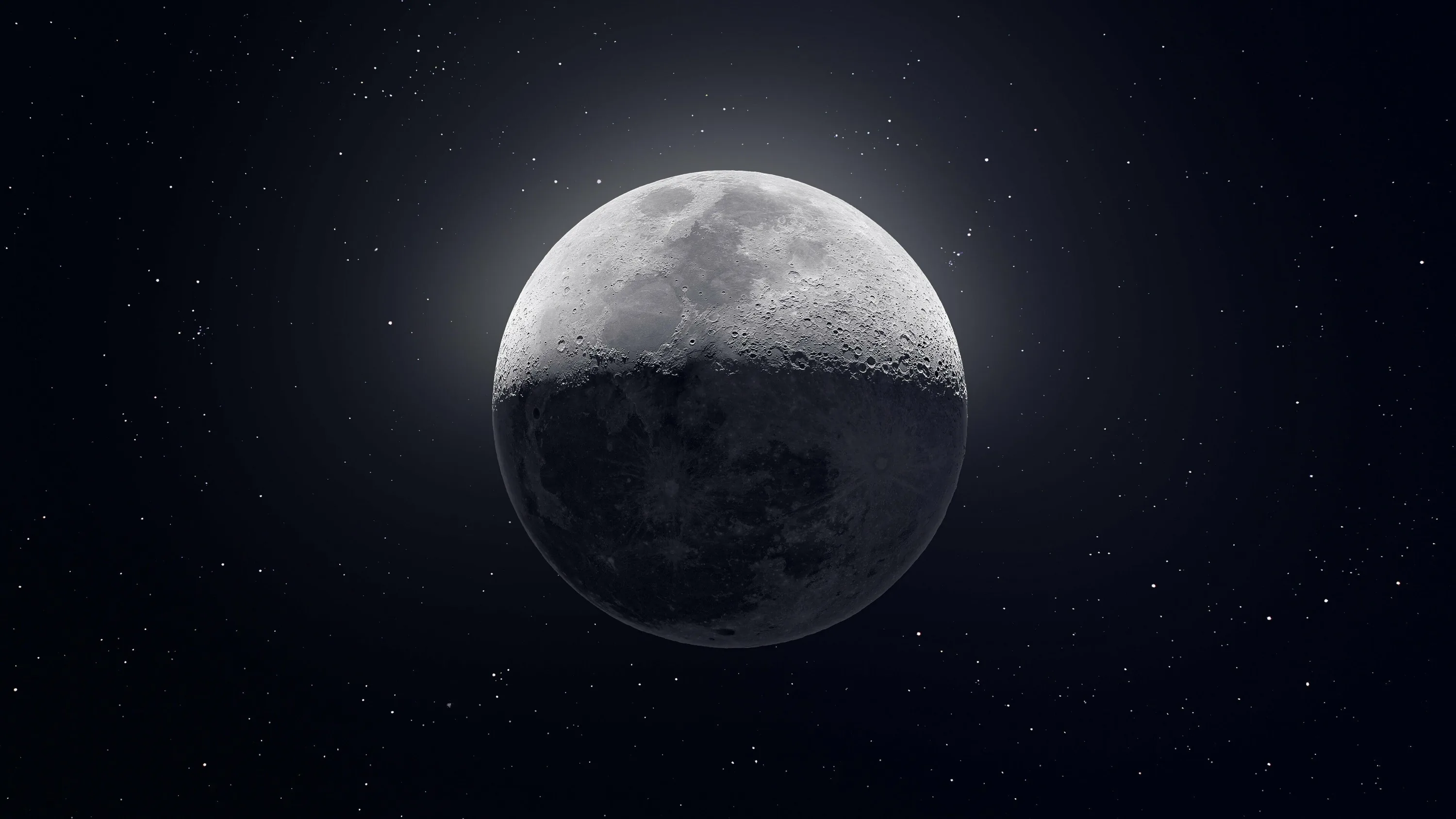 Shadow crosses the moon diagonally, one half in grey light and the other fading into a near-black starfield that suits OLED desktops.