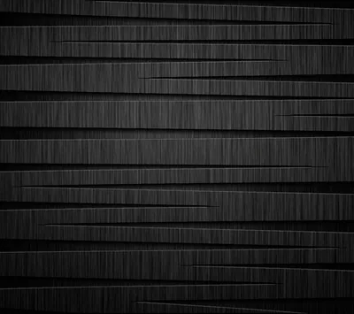 Horizontal planks of dark brushed timber stack up the frame with deep shadow lines between them, one board angled out at the bottom corner.