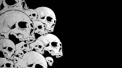 A heap of chalky skulls crowds the left third of a wide black frame, drawn in coarse monochrome with the right side kept completely clear.