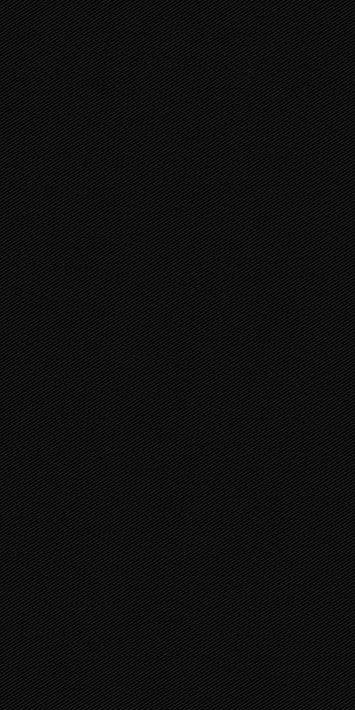 Near-uniform black across the whole frame with a faint fabric-like weave visible only in the lightest patches.