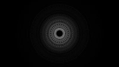 Concentric rings of fine white line work build a mandala at the centre, everything outside it left black.