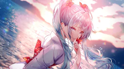 Close-up of a girl with long pastel twin tails in a white kimono, raising a red blossom to her lips as the ocean catches the sunset behind her.