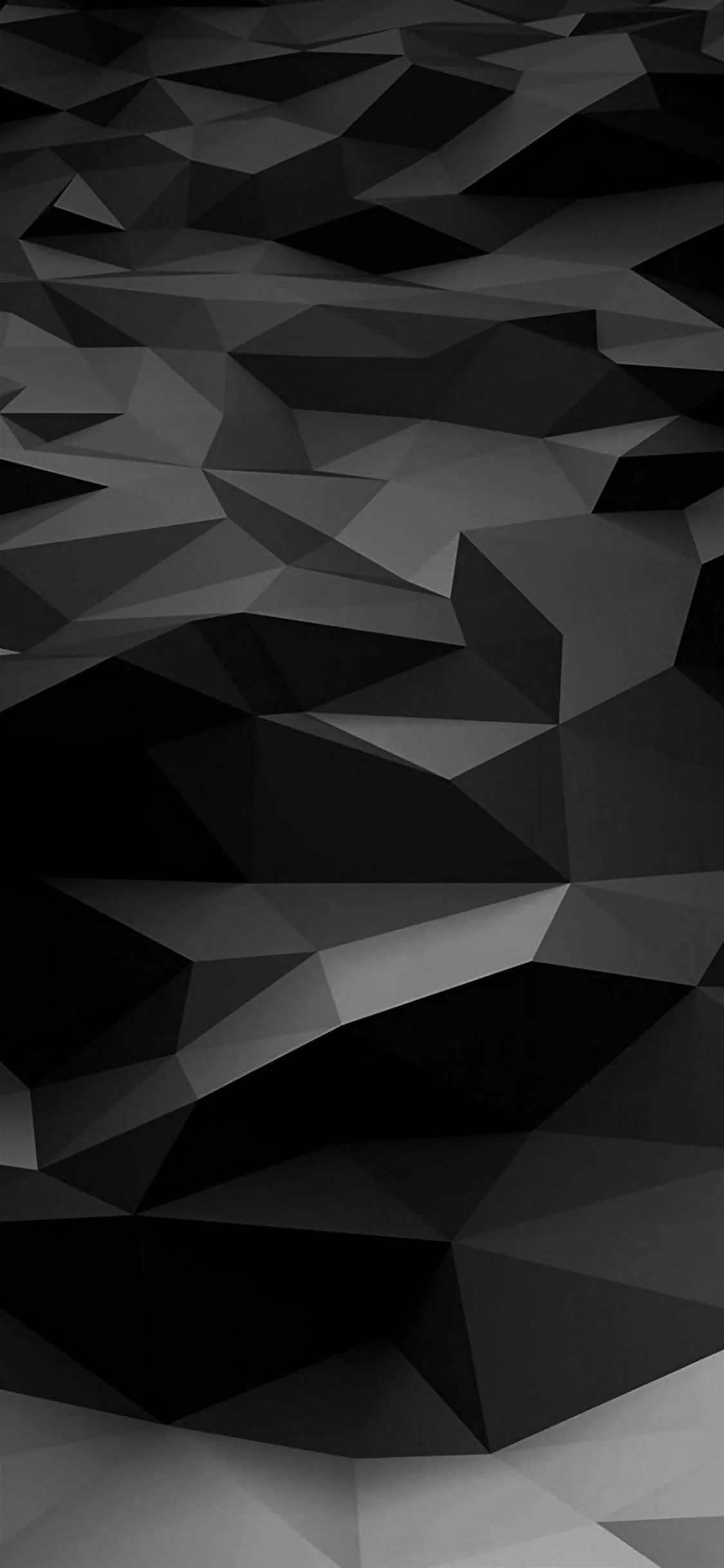 Faceted triangles fold into ridges and valleys, shading from near-white at the top down to solid black across the middle of the frame.