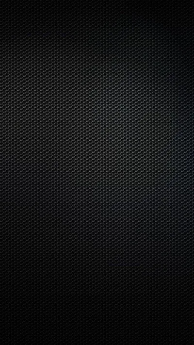A tight grid of tiny raised dots covers the whole frame, brightening slightly toward the centre and falling to solid black at the edges.