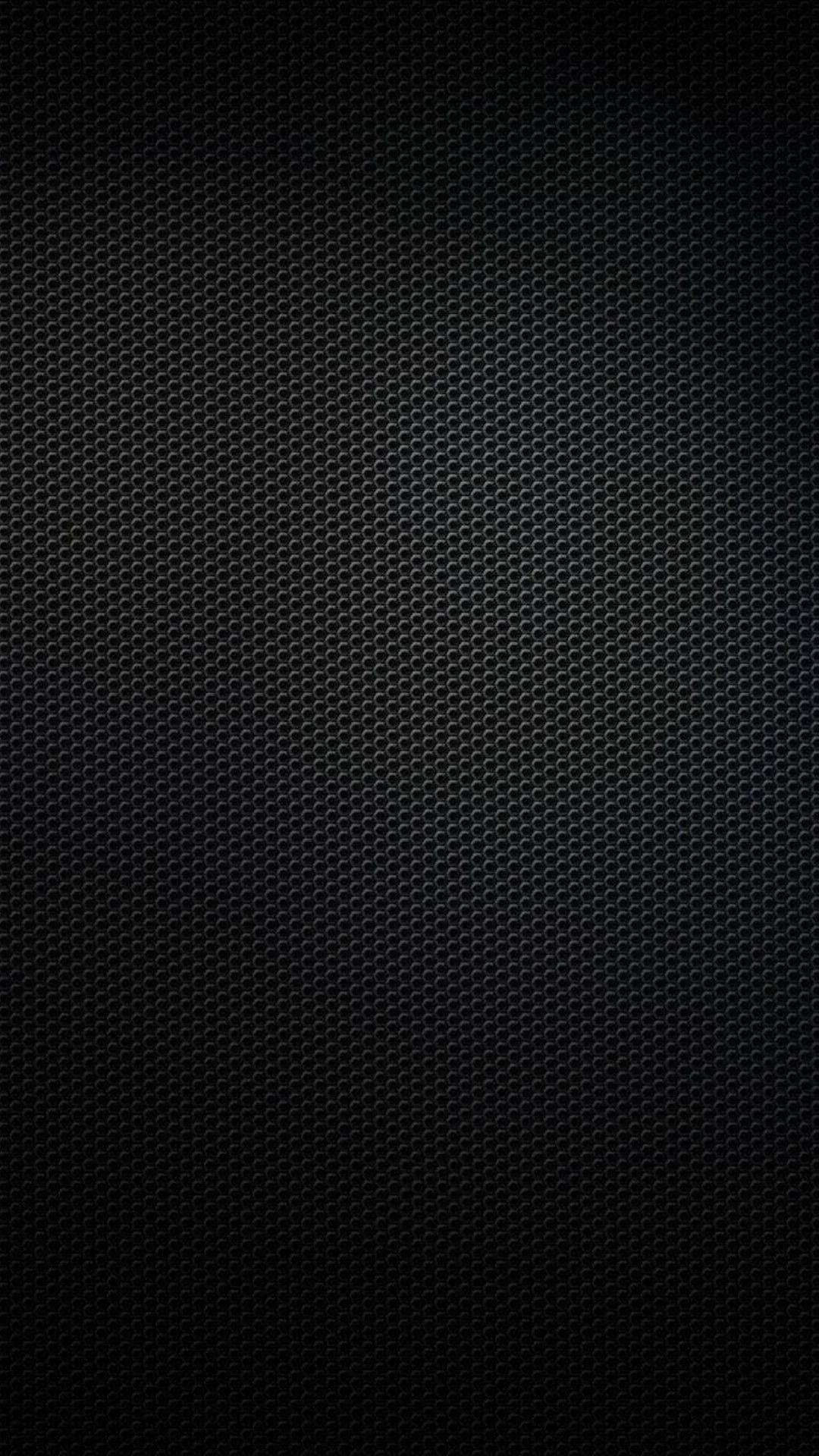 A tight grid of tiny raised dots covers the whole frame, brightening slightly toward the centre and falling to solid black at the edges.