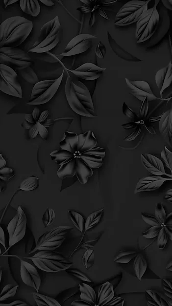 Carved-looking blooms and leaf sprigs sit slightly proud of a matte grey-black panel, the light raking in from the left so each petal keeps its own shadow.