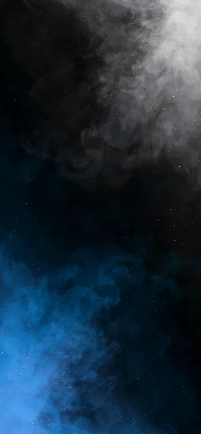 Pale smoke drifts down from the top of the frame and meets a bank of blue fog rising from the bottom, the two blending in a dark band across the middle.