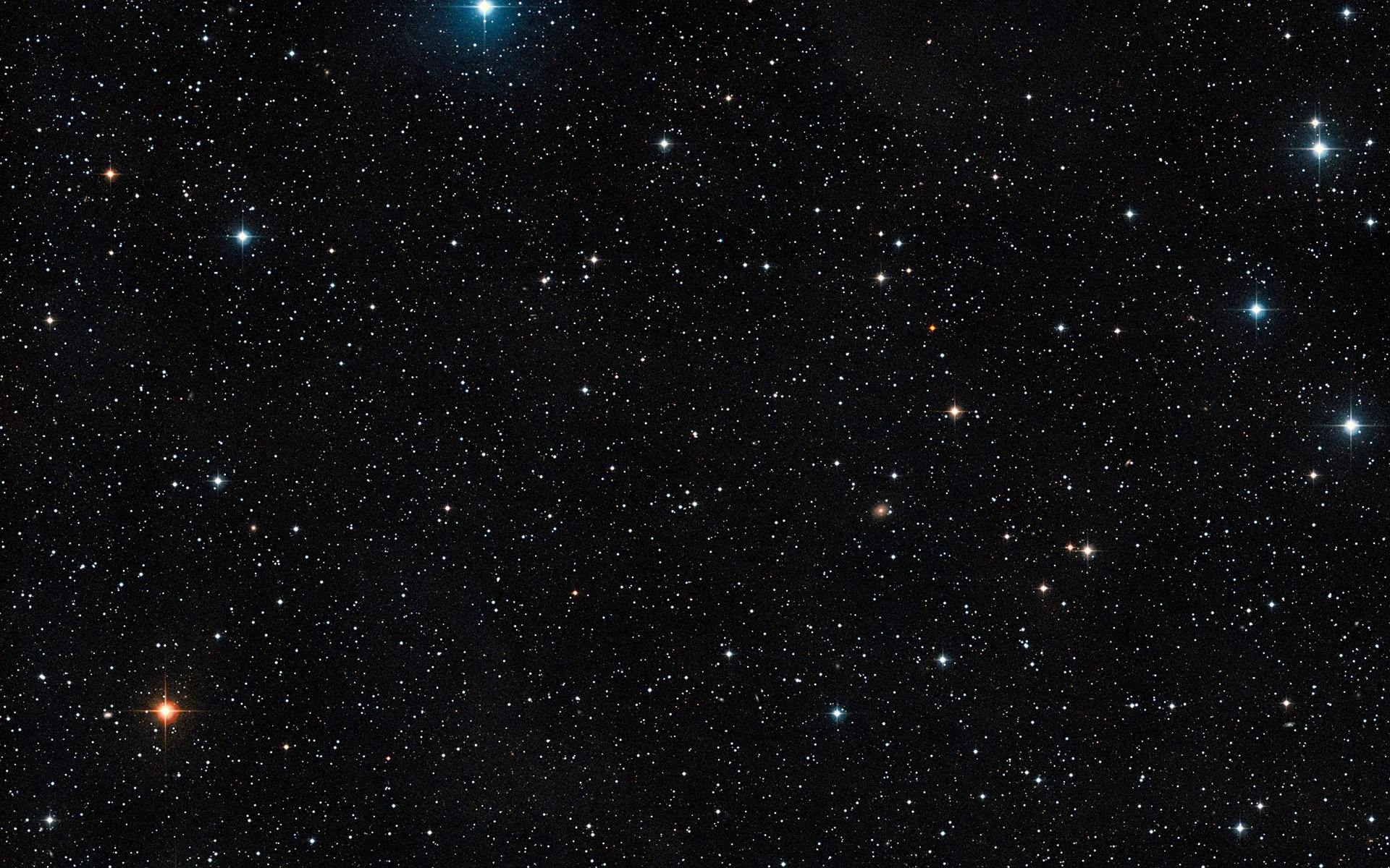 A plain field of stars on black — no nebula, no subject — the kind of quiet backdrop that keeps every icon and widget readable.