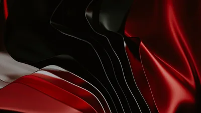 Smooth waves of red and black satin fold into each other, the softest highlight running across the lower third.