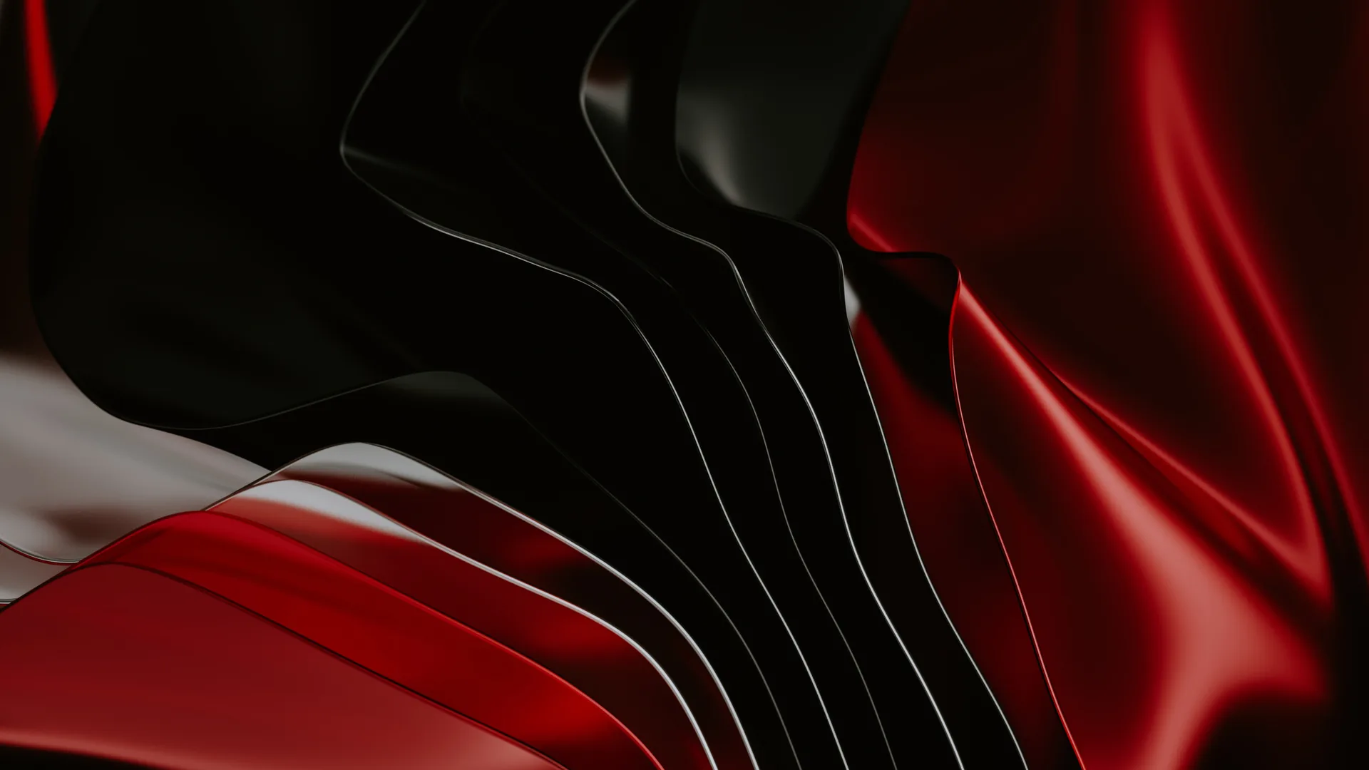 Smooth waves of red and black satin fold into each other, the softest highlight running across the lower third.