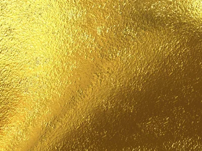Finely grained gold foil lit from above, the brightest patch sitting top-centre while the corners fall into deeper amber.