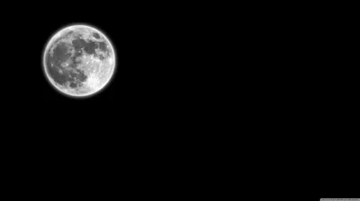The moon hangs alone in the upper left with its craters sharply lit, the rest of the frame left completely black for icons.