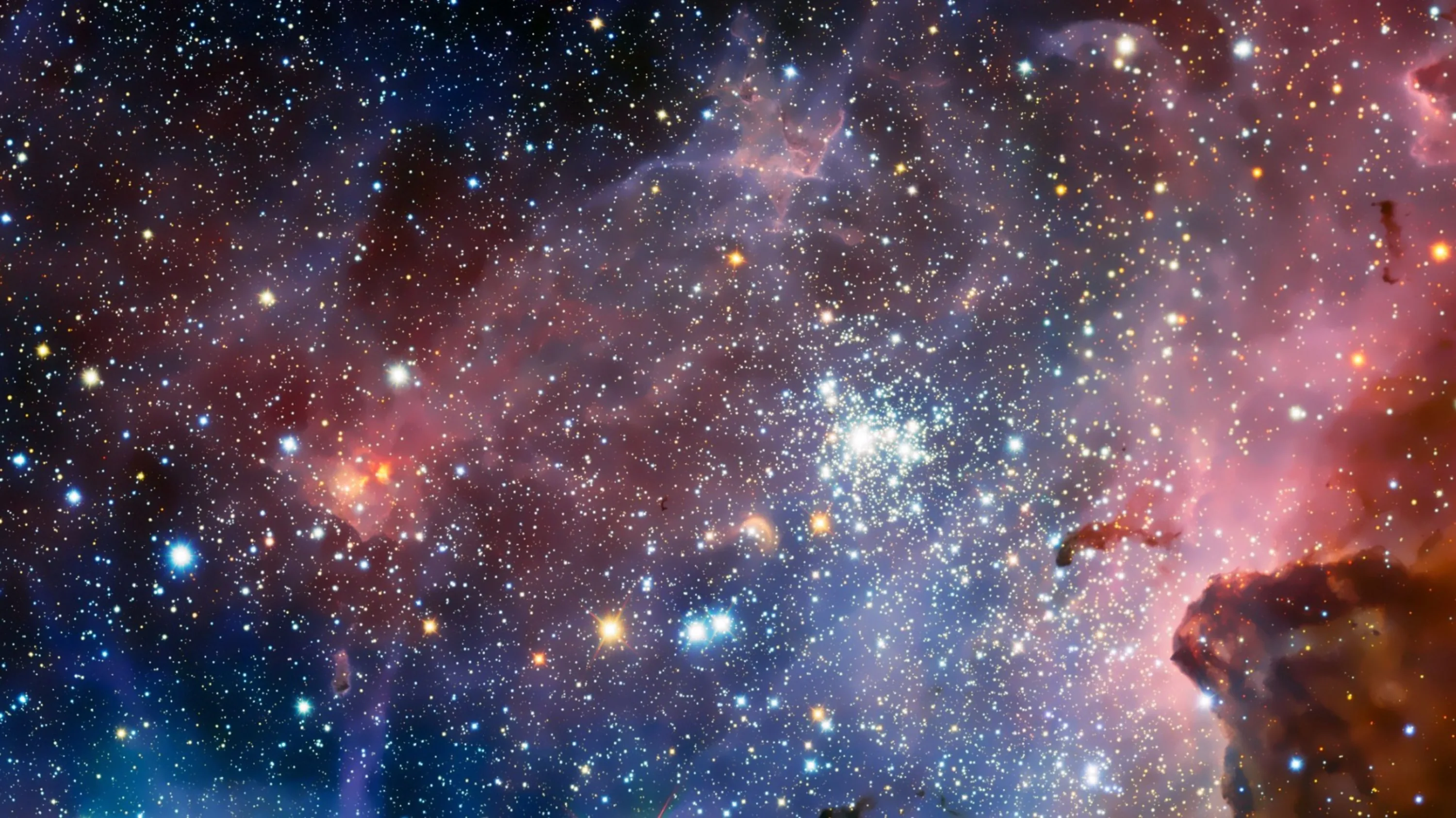 A Hubble-style view into the Carina Nebula, thousands of stars packed around a bright central cluster with pink gas glowing at the edges.