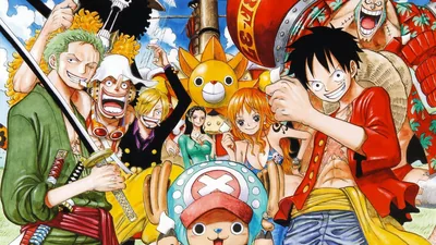 Luffy grins at the front with Zoro, Nami, Sanji and Chopper packed around him, the ship's sun figurehead peeking through the middle of the crowd.