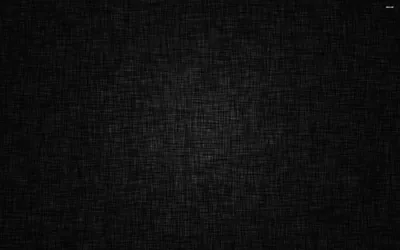 A fine crosshatched weave covers a dark cloth, brightest through the middle and shading into a heavy vignette at the corners.