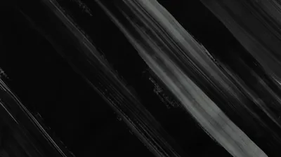 Wide grey strokes drag diagonally across black, the bristle marks visible where the paint runs thin.
