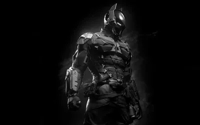 A figure in segmented battle armour steps forward out of darkness, thin grey light running along the helmet and gauntlets.