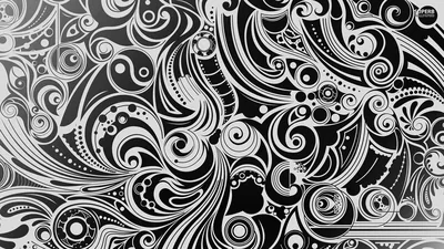 Dense hand-drawn paisley curls and spirals fill the whole frame, inked in white on black with no gap left anywhere.