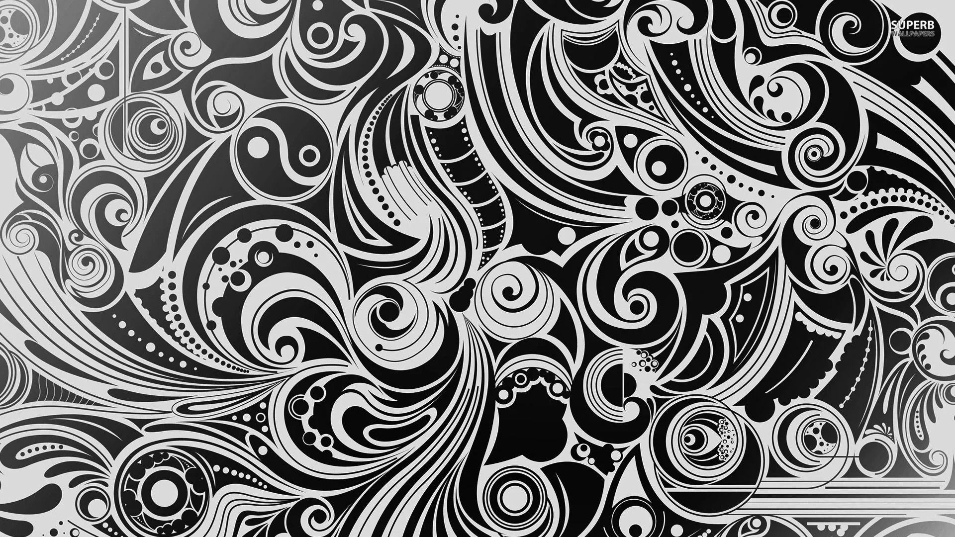Dense hand-drawn paisley curls and spirals fill the whole frame, inked in white on black with no gap left anywhere.