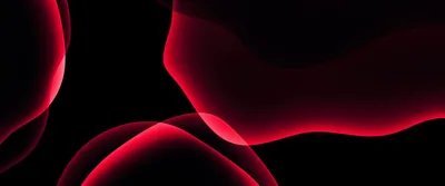 Rounded shapes glow crimson through a black surface, the light softest at the top and pooling toward the lower left.