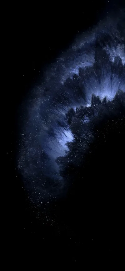 A wing of pale blue gas curves out of the darkness on the right, the rest of the frame left as empty starlit black.