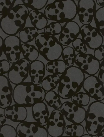 Dozens of hand-drawn skulls overlap edge to edge in two close tones of grey and black, a seamless repeat with no single focal point.