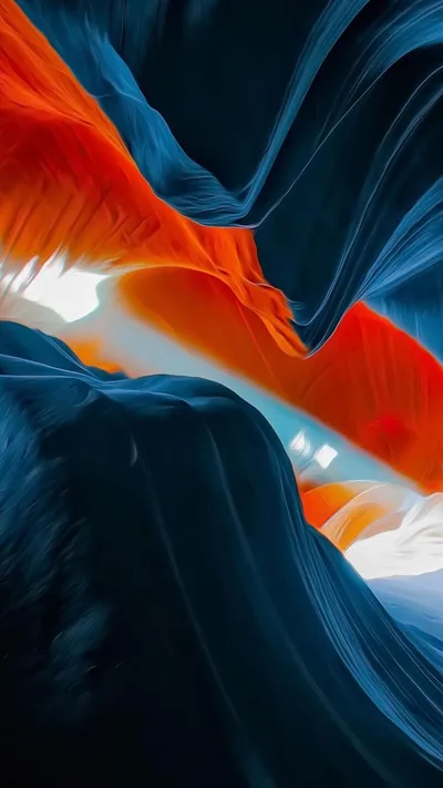 Smooth sandstone-style waves in burnt orange and navy sweep diagonally across the frame, a bright white gap glowing just left of centre like light through a slot canyon.