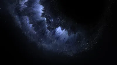 A broad wall of dust curves from the left across a wide black frame, stars showing through the thinner parts of the cloud.