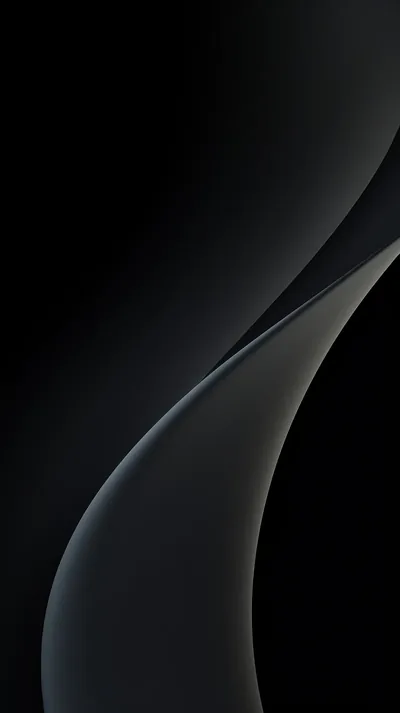A single soft curve sweeps down the frame, one side falling into full black while the other holds a faint grey sheen.