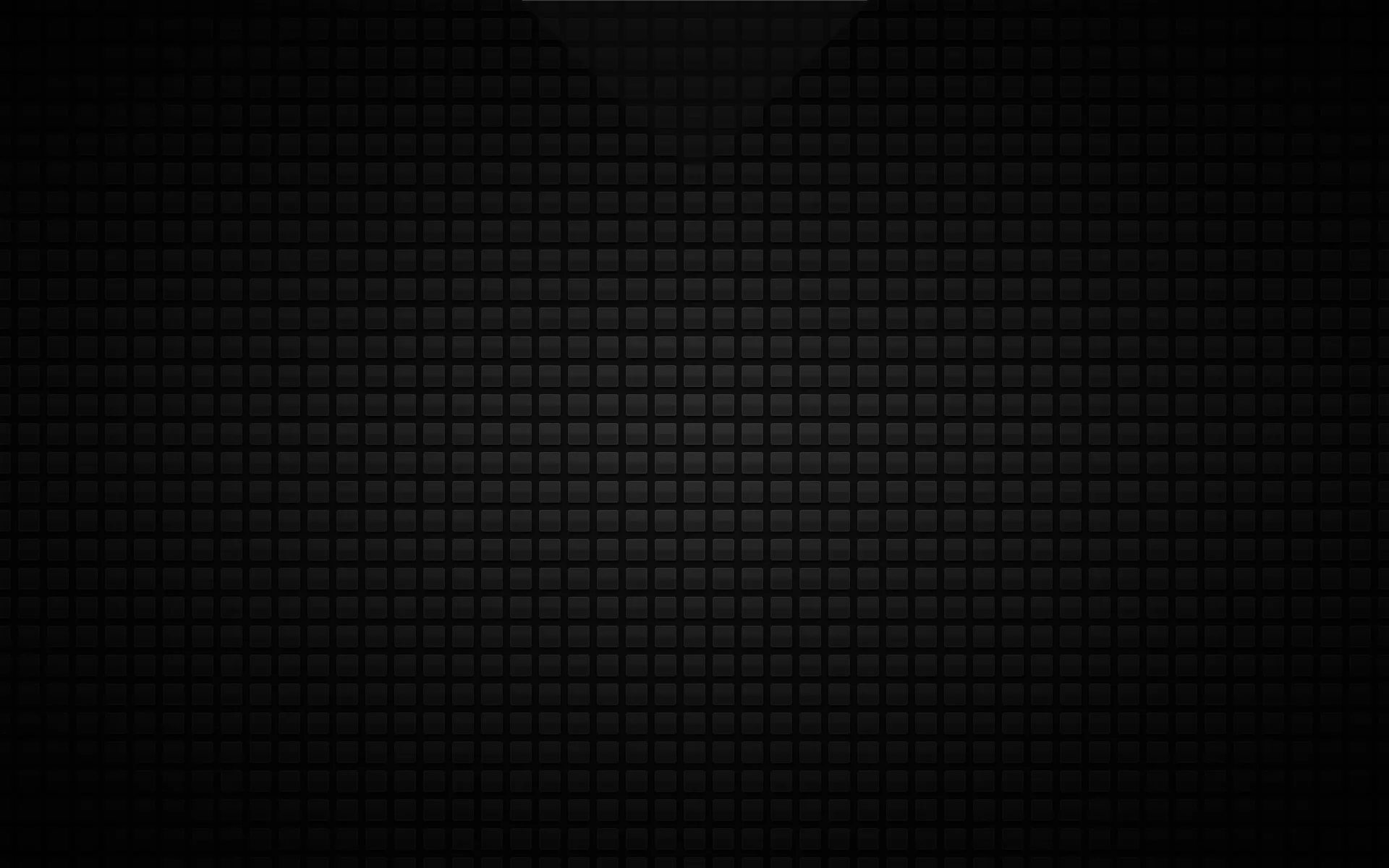 A grid of small rounded squares in charcoal grey covers the frame, lit faintly through the centre and shading down to solid black around the outside.