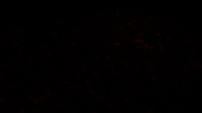 Barely visible dark red streaks run through an almost entirely black frame, so dim they only surface on a bright screen.