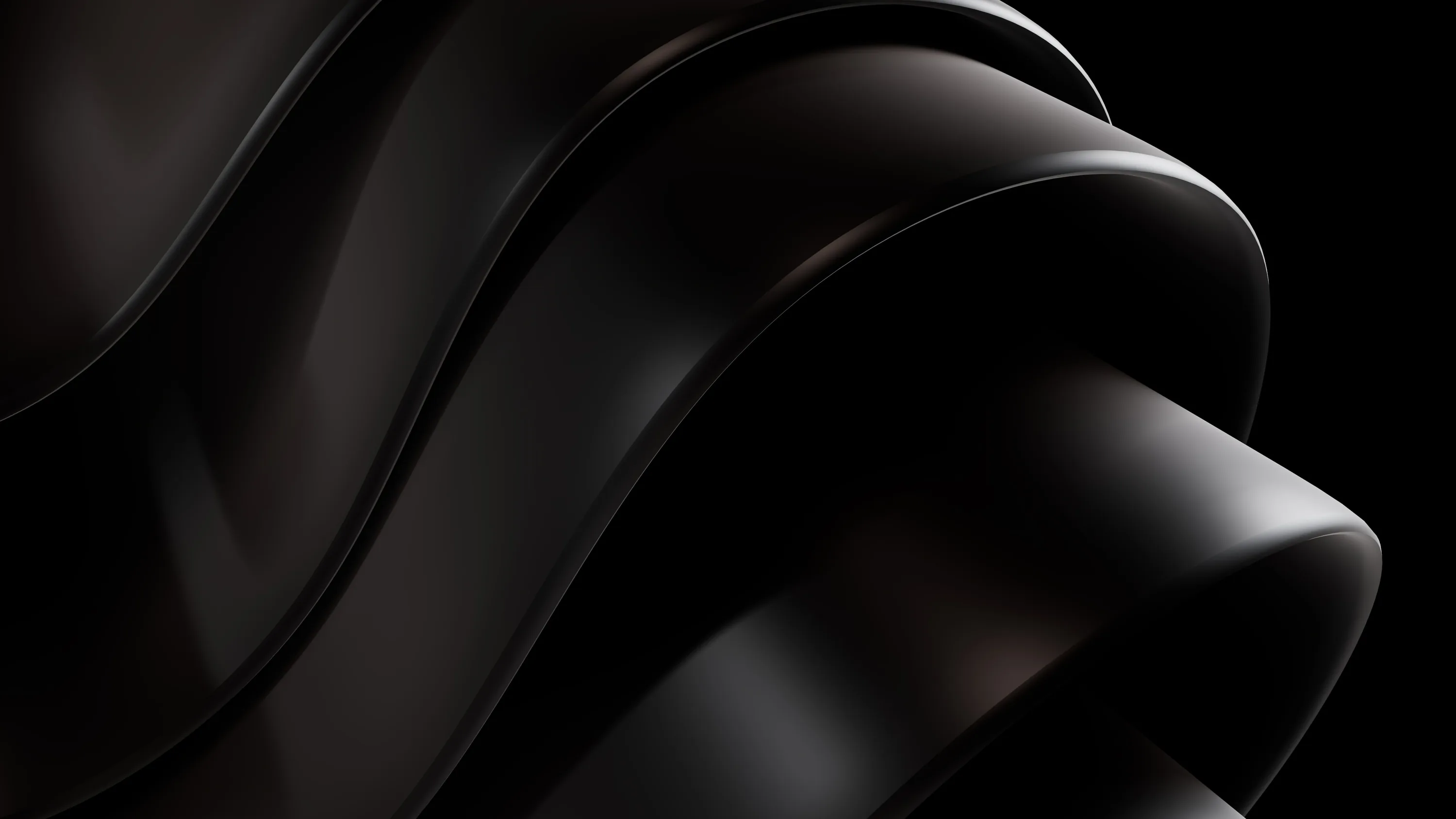 Dark folds of a glossy ribbon curl through the frame, warm brown showing where the light hits.