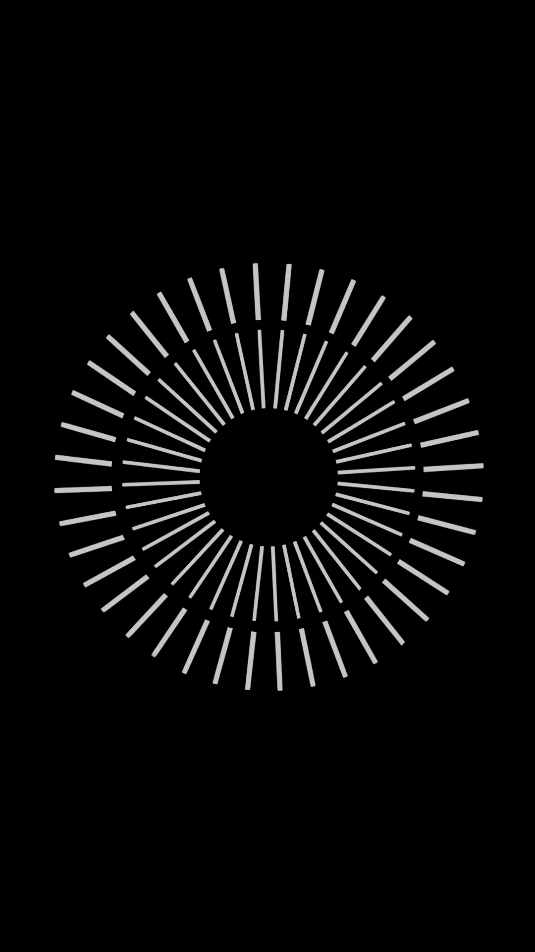 Short white strokes radiate outward in a ring, leaving a black disc at the centre and empty black beyond the outer edge.