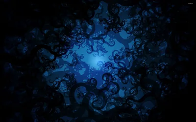 Curled black tendrils crowd the edges of the frame and open toward a soft blue light burning at the centre.