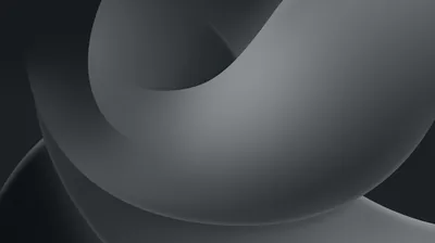 A single sculpted band loops over itself in soft grey gradients, the corners slipping into shadow around the bright curve at the centre.