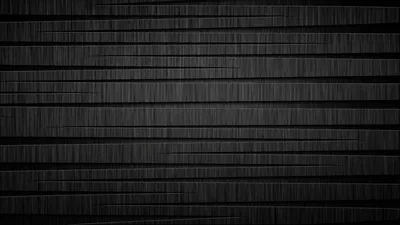 Rough dark slats stack in horizontal bands across the frame, the grain running left to right through each one.