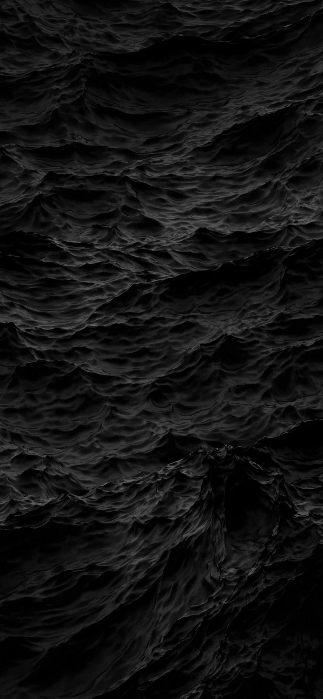 A tall crop of rough open water in near-black tones, every small crest picked out by weak overhead light.