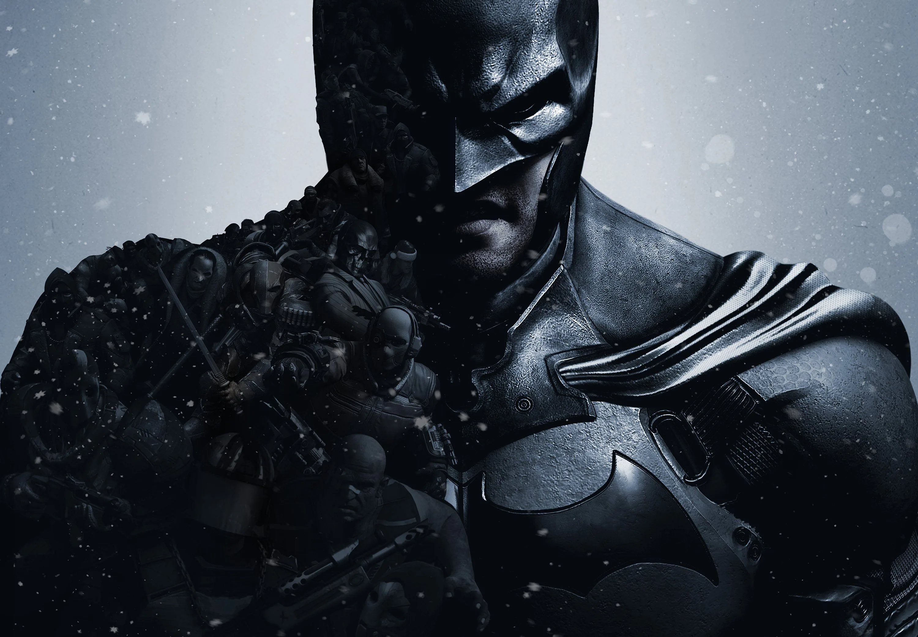 A tight crop on the cowl and armoured chest, snow settling on the shoulders while the bat emblem catches a cold grey light.